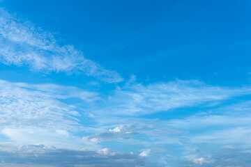 Vibrant Blue Sky with Delicate White Cirrus and Cumulus Cloudscape