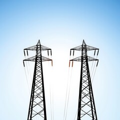 Two high voltage power towers standing tall against clear blue sky for energy generation and power distribution