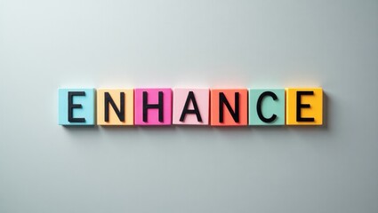 word "ENHANCE" displayed on a grey background