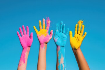 Colorful Painted Hands Raised Against a Clear Blue Sky Symbolizing Creativity and Diversity