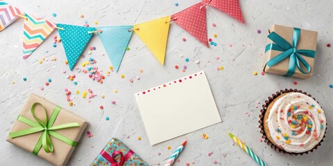 Obraz premium A Festive Celebration Setup with Presents, Confetti, and a Blank Card for a Special Occasion