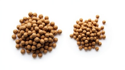 5mm and 3mm fish feed pellets. Two distinct sizes. White background.