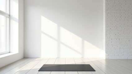 Gym interior in white featuring a black yoga mat and large windows.