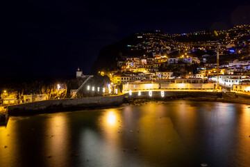 Fototapeta premium Night shot of the fishing village of Camara de Lobos on the Portuguese island of Madeira