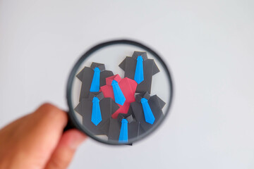 Concept of recruitment, hr, human, resource, employee, recruitment, job, manager, hiring, executive. A group of people are standing in front of a magnifying.