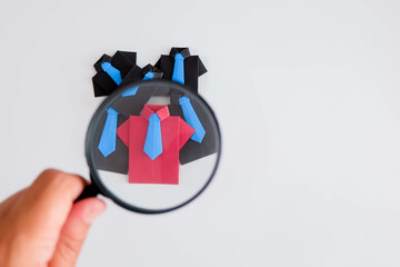 Concept of recruitment, hr, human, resource, employee, recruitment, job, manager, hiring, executive. A group of people are standing in front of a magnifying.