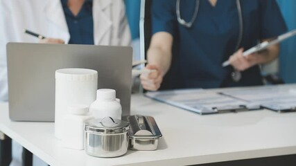 Team, medical analysts and doctors consulting with paperwork of graphs, data and charts in hospital conference room. Closeup of healthcare staff discussing statistics, results and innovation strategy