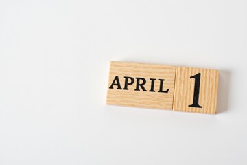 Wooden Calendar Block Displaying April 1, Evoking Themes of Spring and Celebration from a Minimalist Perspective