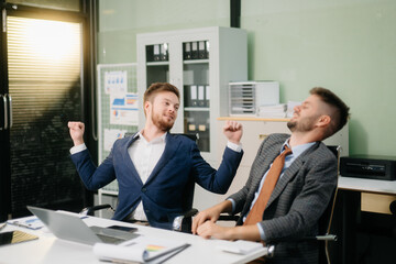 A stressed business team in shock after financial failure. Upset colleagues brainstorm solutions, reacting to bad news