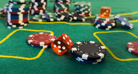 poker chips and cards on the green table background