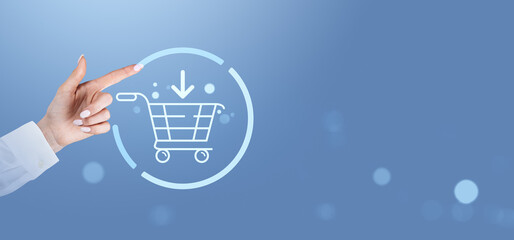 Online shopping concept with holographic cart icon on blue background.
