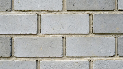 Naklejka premium Gray Brick Wall Texture with Clean Lines and Even Spacing in Urban Setting