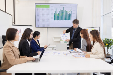 Group of business people working plan analysis at desk in modern office, Documents discussion analysis data the charts graphs, Business financial information and accountant concept.