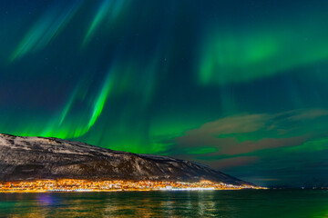Tromsø, Troms, Norway - 28 February 2025 - View of Tromsø on a beautiful night when the amazing Northern Lights appeared © Stefano