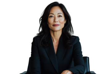 Confident businesswoman in black suit, sitting in chair, smiling warmly. Her professional demeanor conveys leadership and approachability, ideal for corporate settings