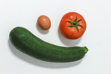 Organic products. Zucchini, egg, and tomato.