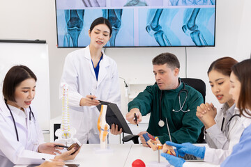 Team of doctor with human model and orthopedic surgeon, Healthcare and medical concept.