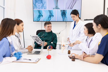 Fototapeta premium Team of doctor with human model and orthopedic surgeon, Healthcare and medical concept.
