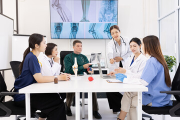 Team of doctor with human model and orthopedic surgeon, Healthcare and medical concept.