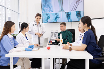 Fototapeta premium Team of doctor with human model and orthopedic surgeon, Healthcare and medical concept.