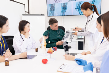 Fototapeta premium Team of doctor with human model and orthopedic surgeon, Healthcare and medical concept.