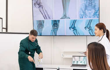 Team of doctor with human model and orthopedic surgeon, Healthcare and medical concept.