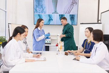 Fototapeta premium A group of doctors working together as a team in a hospital or clinic, Orthopedist doctor team, Healthcare and medical concept.