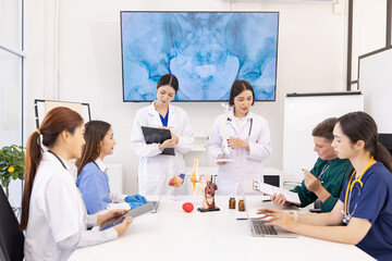 Fototapeta premium A group of doctors working together as a team in a hospital or clinic, Orthopedist doctor team, Healthcare and medical concept.