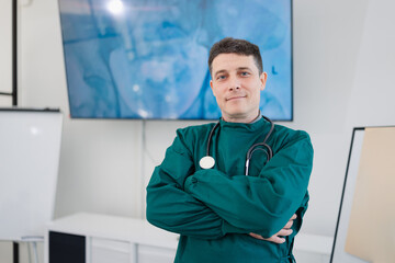 Fototapeta premium Healthcare and medical concept, A male doctor standing arms crossed and stethoscope at hospital.