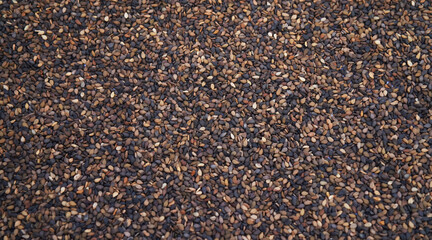 Close-Up of Organic Black Sesame seeds (Sesamum indicum) or Black Til with shell Full-Frame Background. Top View