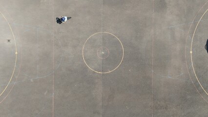 Aerial Birds Eye view of a child riding a bicycle 