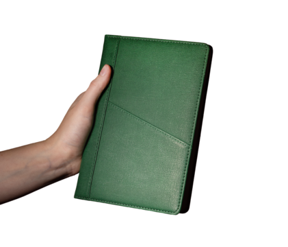 Holding a green notebook planner, daily agenda for scheduling and organizing events. Business, office, and meeting reminder concept. Isolated on white background..