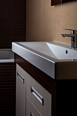 Sleek bathroom with modern sink, emphasizing interior design and cleanliness. Sink and faucet polished, reflecting light beautifully. Perfect for any interior design or bathroom renovation concept