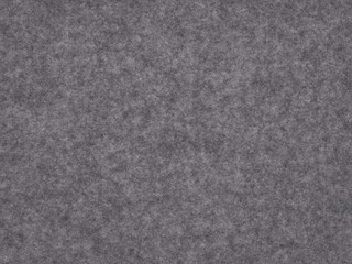 A slate gray felt canvas merges industrial grit with soft, tactile luxury, epitomizing modern urban sophistication