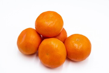 Ripe orange tangerines on a white background