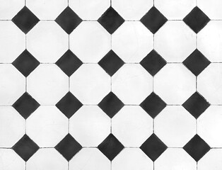 Close up of retro black and white tiles. White square checkered tiles with black diamond pattern....
