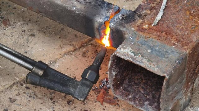 A metalworker demonstrates welding and cutting showcasing skills