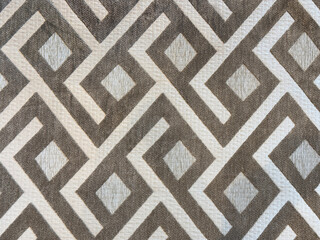 Close up of texture in random geometric diagonal and diamond patterns, with dirt and grunge...