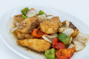 Sea Bass in black peppercorn, Stir fried Fish fillet with black pepper sauce, Stir Fried Sea Bass with Black Pepper. Boneless fish fried until crispy, stir-fried with sauce