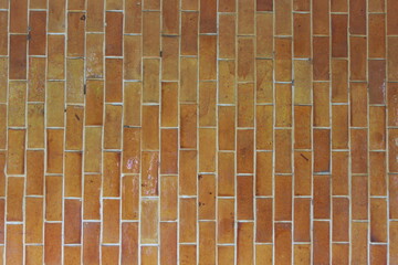 Wide cream brick wall with beige, old brown brick and limestone textures, perfect for abstract backgrounds
