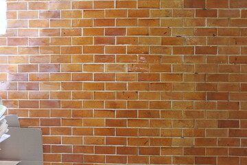 Wide cream brick wall with beige, old brown brick and limestone textures, perfect for abstract backgrounds
