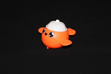 a children's toy in the shape of a vehicle on a black background