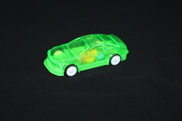 a children's toy in the shape of a vehicle on a black background