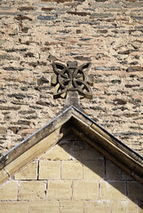 Roof gable stone carving detail on Abbey Church of Sainte-Foy in Conques, France