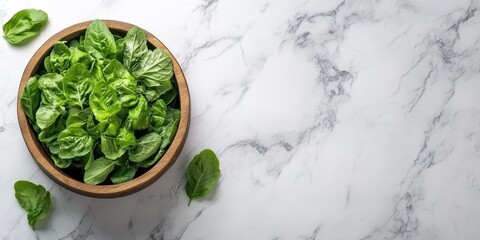 Obraz premium Fresh Greens in Wood Bowl. Natural Light on Marble Surface Backdrop Studio Food