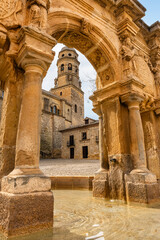 Obraz premium Beautiful stone fountain from antiquity in the square of the cathedral of Baeza, Jaen.
