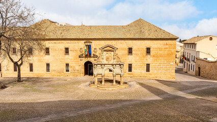 Beautiful stone fountain from antiquity in the square of the cathedral of Baeza, Jaen.