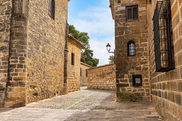 Narrow alleys with medieval-style stone buildings in the beautiful town of Baeza, Andalusia