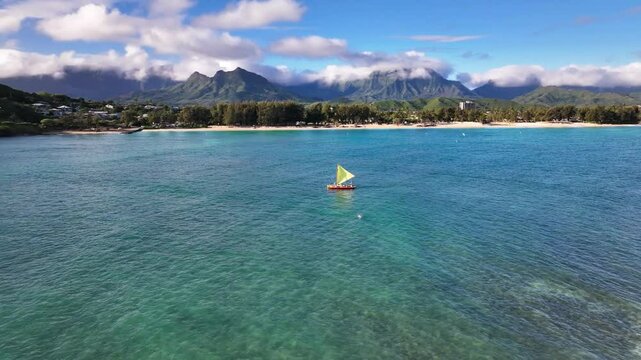 Morning swim and sail in Kailua Bay from Flat Island with Kailua and Koolau Mountains in the background