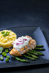 Green asparagus with grilled chicken fillet and couscous